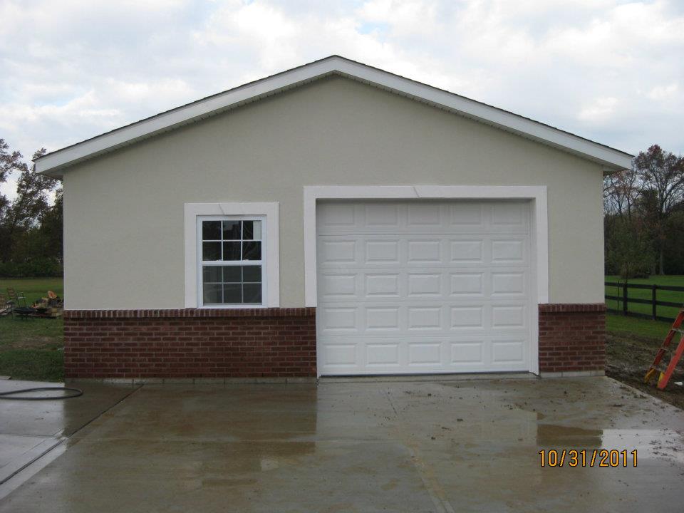 24'x32' garage with brick wainscot and dryvit application. - Timberline  Buildings