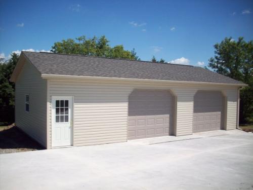 24'x40' with two garage doors and vinyl siding!