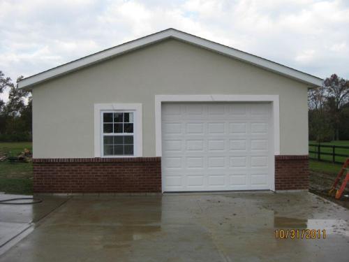 24'x32' garage with brick wainscot and dryvit siding application.