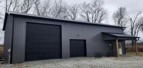 36'x50'x14' Pole Barn with Black doors and black Anderson windows! Small 8'x16' porch!