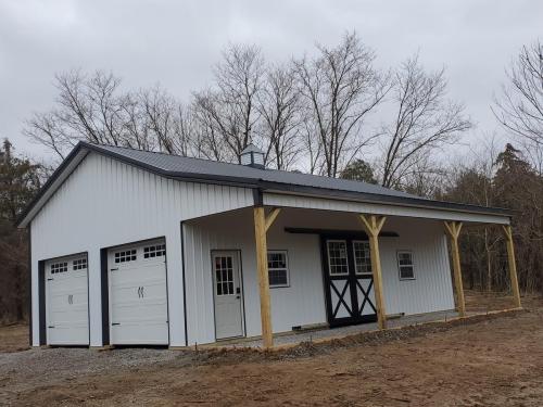 Spacious 2 car garage with porch and Arcadian slider for style and design!