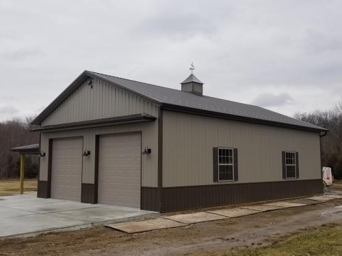 30'x48'x14' Pole barn with brow and hipped porch for storage. 3'x3' cupola for character!