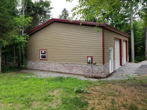 30'x40' Post frame garage with cement board siding by Allura and brick veneer wainscot!